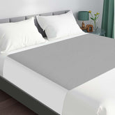 LotuFlor king-size bed pad with waterproof top layer protects mattress overnight