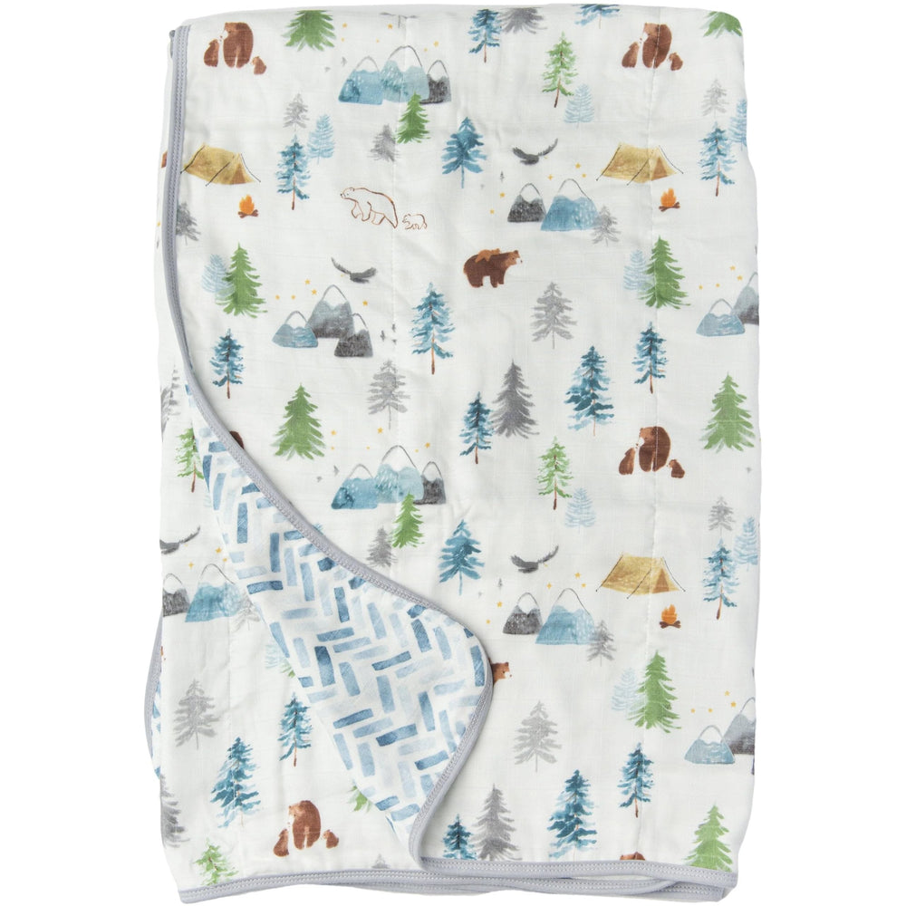 Loulou Lollipop muslin quilt blanket crib setup shows breathable Tanboocel fabric for safe naps.