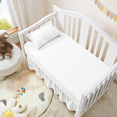 Love2Sleep crib skirt with four split corners for easy placement around posts