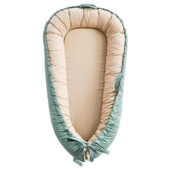 LOVE MAGE baby lounger in green, front view, breathable cotton for tummy time.