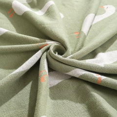 Loyfoky green goose blanket adds color and comfort to the nursery.
