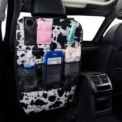LSBS cow print kick mat storage pockets keep toys organized during travel.