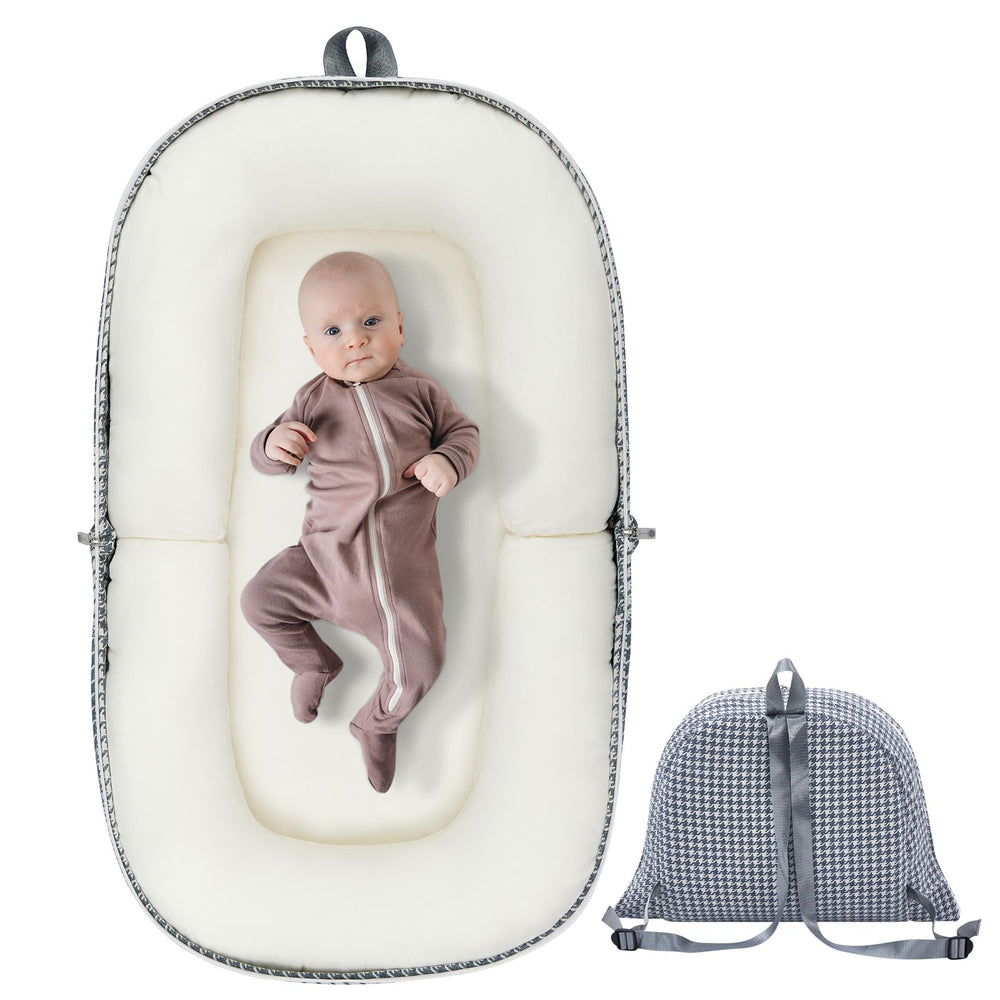 Lucakuins Baby Lounger folded for travel, showing easy portability.