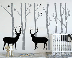 LUCKKYY birch tree deer wall decal in grey for nursery creates a peaceful forest scene.