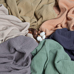 Lulu Moon muslin blanket close-up weave, soft airy layers for year-round comfort