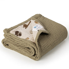 Lulumoon dinosaur muslin blanket; soft breathable fabric ideal for stroller sun shade.