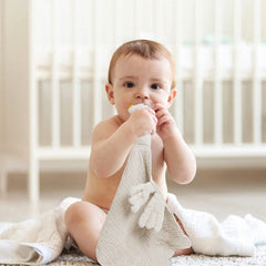 lulumoon muslin lovey in baby crib for nap time comfort