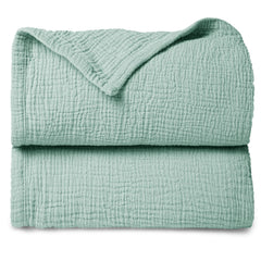 Lulumoon sage muslin baby blanket close-up fabric texture for softness.