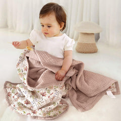 Lulumoon muslin blanket sand floral back view, breathable comfort on warm days.