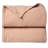 Lulumoon pink muslin blanket front view shows soft four-layer cotton texture for baby comfort.
