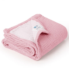 Lulumoon muslin blanket in pink cradles newborn warmth with soft cotton.