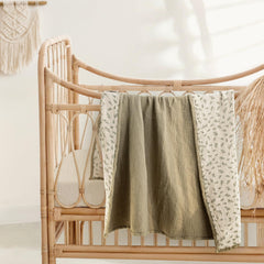 Lulumoon muslin blanket Olive Tree pattern offers versatile nursery decor and cozy nap times.