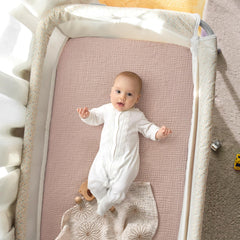 lulumoon Pack N Play Sheets muslin folded to illustrate compact storage and reuse.
