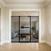 Lumizone extra tall cat gate in doorway containing adventurous pets