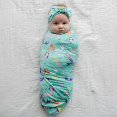 Lunaluxe bamboo swaddle fabric close-up showing silky softness and breathability