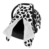 Lunepon cow-print car seat cover shields baby from sun and wind in the car.