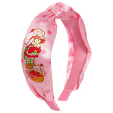 LUV HER Strawberry Shortcake knotted headband, front view, vibrant design for playful everyday wear.