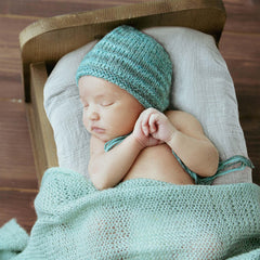 LYRICHOM BABY fitted sheet with 360-elastic for a snug bassinet fit.