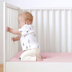 Magik & Kover sheets compatible with Dream on Me mini cribs for easy setup.