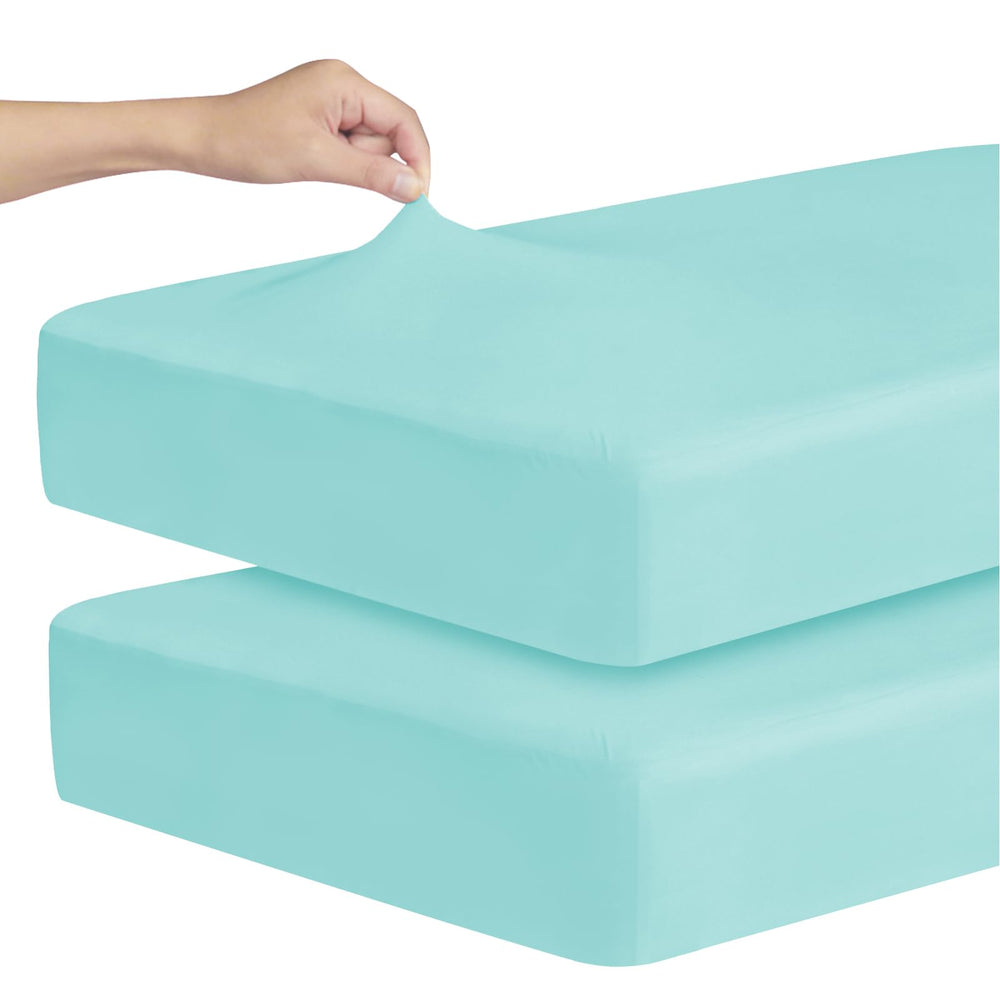 Magik & Kover stretchy crib sheet in aqua blue offers soft, breathable comfort.