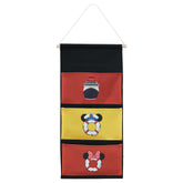 Magopera DCL three-pocket fish extender on cabin door for organized gift exchanges.