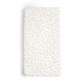 Makemake Organics changing pad cover in wild leopard print for on-the-go diaper changes.