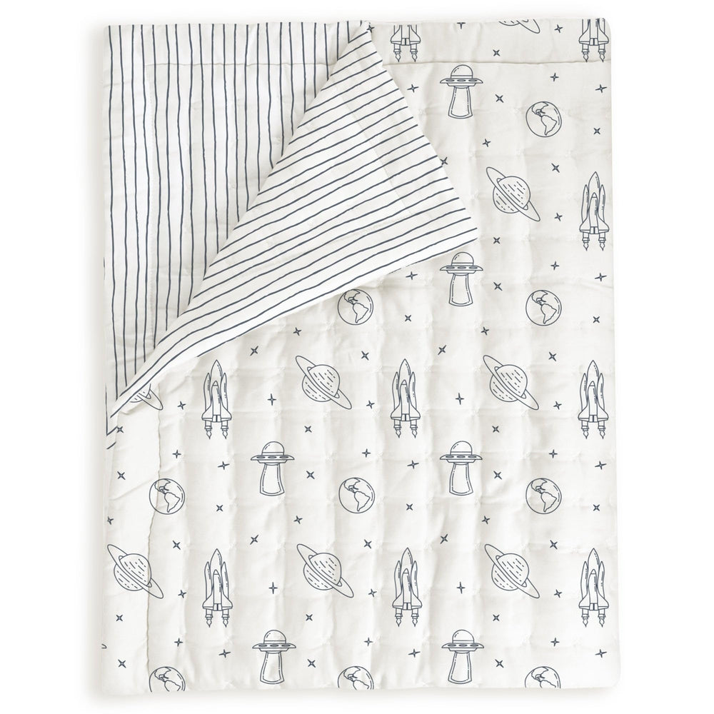 MakeMake Organics toddler comforter with astronaut print gives cozy nights in soft organic cotton