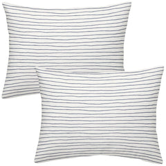 Makemake Organics toddler pillowcase navy stripes closeup with breathable cotton sateen texture.
