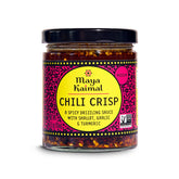 Maya Kaimal Chili Crisp jar on counter, a versatile noodle topping.
