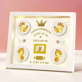 MCstars Baby Handprint Frame with gold lettering on a modern white design for nursery display
