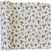 Mebie Baby Autumn Bloom swaddle laid out for newborn snugness and breathable comfort