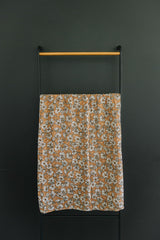 Magnolia Muslin Swaddle in a neutral nursery, stylish and versatile.