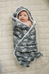 Bathroom scene with colorful Mebie Baby hooded towel for boy or girl