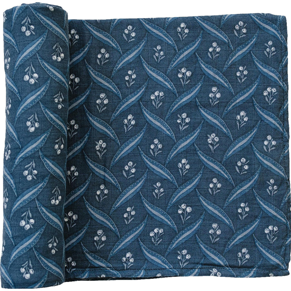 Mebie Baby Navy Berry Swaddle folded, a soft muslin blanket for secure newborn swaddling.