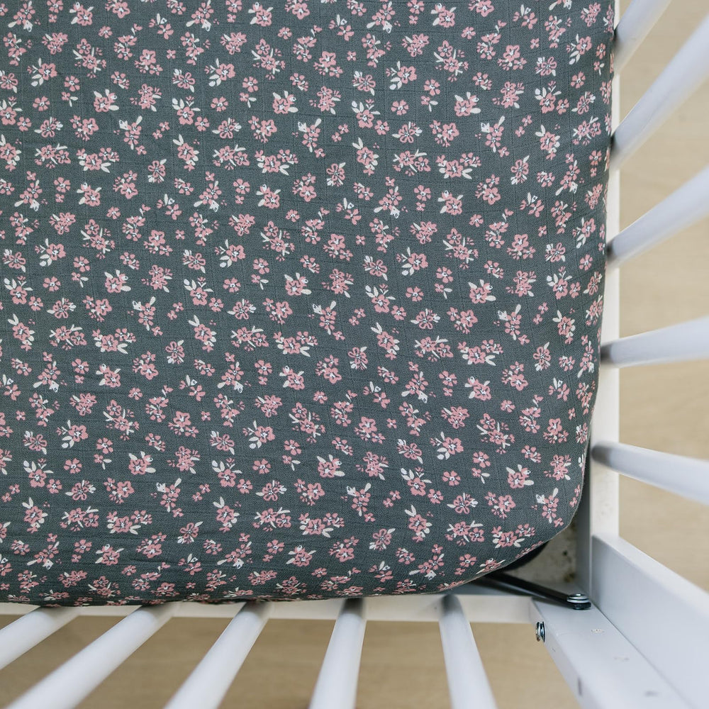 Mebie Baby Olive Bloom muslin crib sheet on a standard crib mattress, breathable.