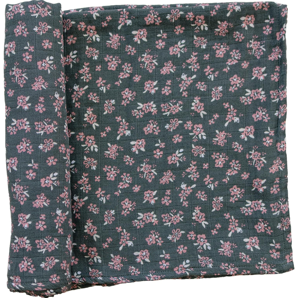 Mebie Baby Olive Bloom swaddle close-up reveals breathable muslin fabric and soft texture.
