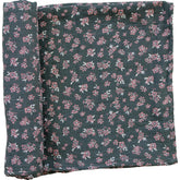 Mebie Baby Olive Bloom swaddle close-up reveals breathable muslin fabric and soft texture.