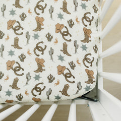 Mebie Baby Outlaw Cowboy muslin crib sheet offers breathable comfort for naps