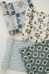 Mebie Baby 47x47 swaddle ready for a secure wrap.