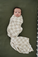 Mebie Baby taupe checkered swaddle folded to show size