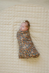 Mebie Baby Venetian Floral Swaddle wrapped around a baby for secure swaddling.