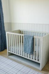 Mebie Baby Vintage Plaid Muslin Crib Sheet on mattress showcasing gender-neutral design.