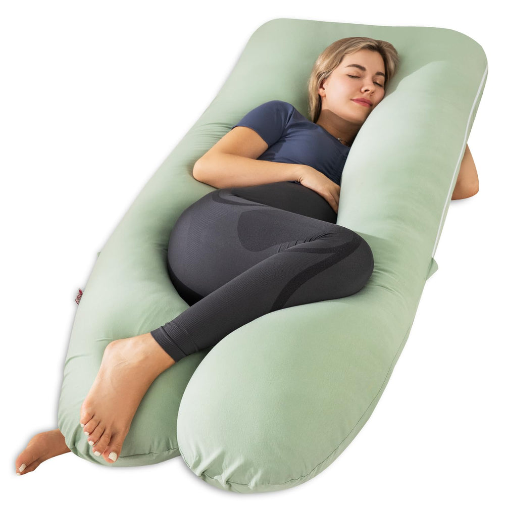 Meiz pregnancy pillow in U-shape on bed showing full-body support.