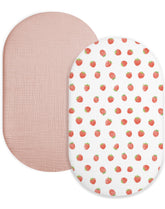 Meowcards bassinet sheet in strawberry and pale pink, soft muslin for gentle baby sleep.