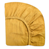 Meowcards mini crib sheet in mustard yellow, soft muslin for baby comfort.