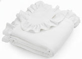 Meowcards muslin swaddle with white ruffles for gentle newborn comfort.