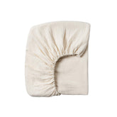 Meracorallo muslin crib sheet cream on crib demonstrates breathable, soft sleep surface