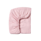 Meracorallo muslin crib sheet pink close-up fabric shows breathable cotton softness.