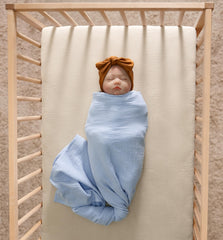 Soft, pre-washed Meracorallo crib sheet adds extra softness for baby naps.
