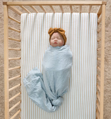 Meracorallo muslin fitted crib sheet shows deep pocket for secure grip